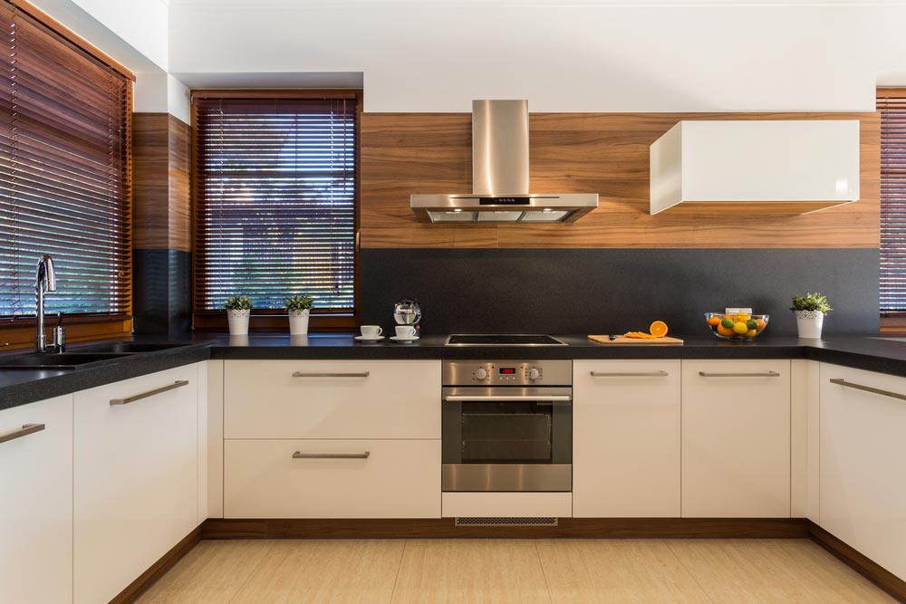 Modern Kitchen With White Cabinets — Inovative Interiors in Cardiff, NSW